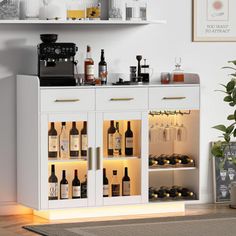 a white cabinet filled with lots of bottles and glasses next to a potted plant