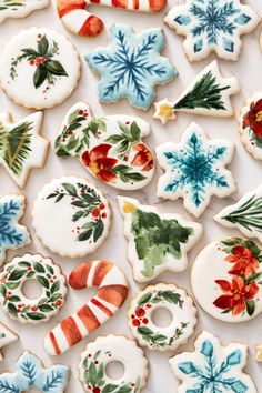 decorated christmas cookies on a white surface