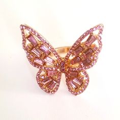 Brand New Pink Rhinestones And Gold Color Butterfly Adjustable Band Ring. Never Used, Clean, Mint Condition. Message Me With Any Questions. See All Of My Other Items For Sale. Thanks For Visiting. Trendy Pink Cubic Zirconia Jewelry, Pink Cubic Zirconia Party Rings, Pink Ring With Sparkling Stones, Trendy Pink Butterfly Jewelry, Pink Rhinestone Rings For Gifts, Trendy Pink Rhinestone Jewelry, Pink Rhinestone Party Rings, Pink Crystal Ring For Gift, Pink Party Rings With Rhinestones