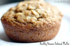 a close up of a muffin on a plate with the words healthy banana oatmeal muffin