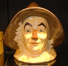 a close up of a statue of a person wearing a hat