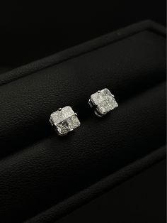 These Cushion Cut Illusion Diamond Stud Earrings give the captivating appearance of 1.75 carat diamonds for a fraction of the cost! The total diamond weight (DW) on these elegant earrings is 1.06 carats. Expertly crafted, the earrings feature a combination of 4 mixed cut diamonds that are meticulously matched and set in an illusion setting to enhance their brilliance and size appearance. VAJR Designs Features Gold KT: 18K Gold Color: White Gold (Available in Rose Gold & Yellow Gold - "Made to Order") Diamond Shape: Cushion Total DW: 1.06 carats 1.75 CTS Look Clarity: VVS/VS Color: F/G Setting Type: Illusion Setting Features Mixed Cut Diamonds Description These exquisite Cushion cut diamond stud earrings are a triumph of illusion, designed to create the look of larger, more luxurious diamon Luxury Diamond Earrings With Square Cut, Luxury Brilliant Cut Cluster Earrings In Diamond White, Formal Platinum Earrings With Single Diamond, Luxury Diamond Cut Cluster Earrings For Anniversary, Formal Round Cut Baguette Diamond Earrings, Formal Baguette Diamond Earrings With Round Cut, Diamond White Luxury Cluster Earrings With Prong Setting, Luxury Diamond White Cluster Earrings With Prong Setting, Luxury Platinum Diamond Earrings With Single Diamond