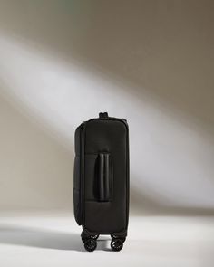 Experience the lighter side of travel with our soft-shell carry-on, ideally sized for shorter stays and spontaneous getaways within European airline restrictions. Our lightest suitcase is designed to minimize hassle and maximize the joy of travel. Crafted from fully recycled lightweight polyester, inside and out, Soft Stripe’s innovative construction ensures superior strength and durability with a more responsible outlook. Deep, spacious compartments and internal pockets are thoughtfully designe On-the-go Black Nylon Luggage, Nylon Luggage With Zipper Closure For On-the-go, Business Nylon Luggage With Zipper Closure, Nylon Travel Accessories With Luggage Sleeve For On-the-go, Nylon Travel Accessories With Luggage Sleeve, On-the-go Travel Accessories With Luggage Sleeve In Nylon, Nylon Luggage For Overnight Trips, Rectangular Nylon Luggage For Overnight Trips, Black Nylon Luggage For Travel