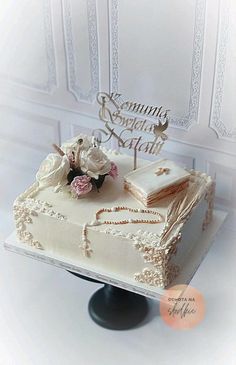 a wedding cake with white frosting and flowers on top