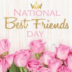 pink roses with the words national best friends day in gold lettering on a white wooden background