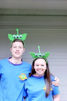 two people dressed in costumes standing next to each other