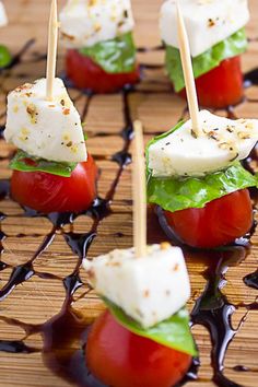 mini caprese appetizers with mozzarella cheese and tomato on them