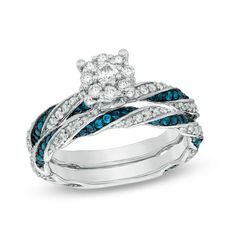 an engagement ring set with blue and white diamonds