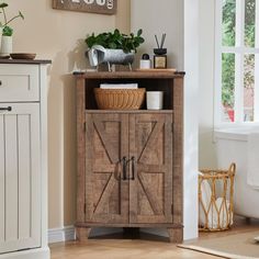 a wooden cabinet sitting in the corner of a room