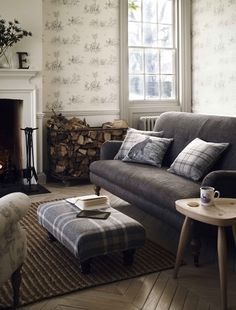 a living room filled with furniture and a fire place