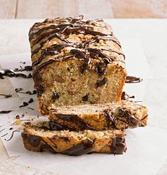 there is a loaf of bread with chocolate drizzled on it and sliced into slices