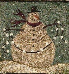 a snowman is sitting on the ground in front of some bushes and trees with lights