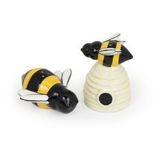 two ceramic bees sitting next to each other