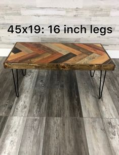 the table is made out of wood and has hairpin legs on each side, which are