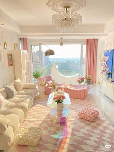 a living room filled with lots of furniture and a chandelier hanging from the ceiling