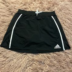 Nwot. Black With White Side Stripes. Athletic Skirt With Built-In Shorts. Side Slits. Elastic Waist With Tie And Cinch Waist. Size Small. 100% Polyester (Skirt) 91% Polyester, 9% Spandex (Shorts) 14.5" Waist 16" Length Cheap Navy Adidas Tops, Athletic Skirt Outfit, Adidas Skirt, Athletic Skirts, Polyester Skirt, Athletic Skirt, Spandex Shorts, Side Stripe, Black Adidas