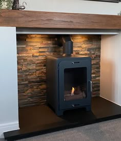 a fireplace with a wood burning stove in it