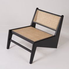 a black chair with woven seat and back