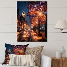 a living room scene with focus on the street lights and tree's in the background