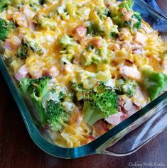 a casserole dish with broccoli, ham and cheese