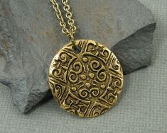 Men's coin necklace features an ancient style ornate antique gold pendant. Your choice of chain lengths - 18, 20, 24, 30 Pendant is made of antique gold plated pewter and is 15/16 inches in diameter (24mm). Find more men's jewelry styles here - https://www.etsy.com/shop/CharleneSevier?ref=hdr_shop_menu&section_id=10866473 Antique Gold Pendant, Crow Pendant, Boys Necklace, Raven Necklace, Jewelry Styles, Hippie Earrings, Necklace Antique, Medallion Necklace, Mens Pendant