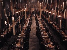 a very long table with many candles in it