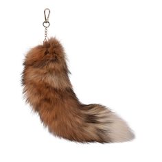 a furry animal keychain hanging from a chain