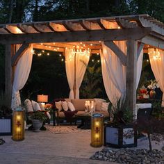 an outdoor patio covered in white curtains and string lights with text overlay that reads best ways to protect your patio furniture