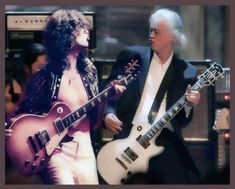 two men are playing guitars and one is wearing a black suit with white hair on his head