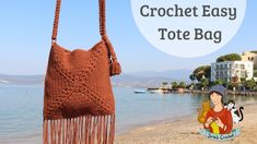 a crocheted bag hanging from a rope on the beach with text overlay that reads heybe canta yapmu