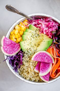 a bowl filled with different types of fruits and vegetables