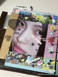 a binder with an image of a woman's face and stars on it