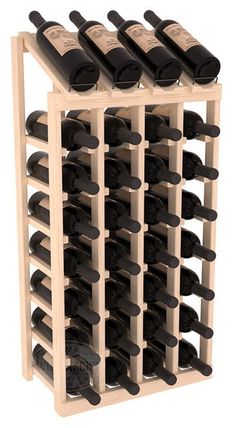 a wooden wine rack filled with lots of bottles