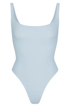 With the look of your favorite tank, this molds-to-your-body one-piece is made of buttery soft fabric with a square neckline and a thong back. Snaps between legs Square neck Sleeveless Snap cotton-lined gusset 76% polyamide, 24% elastane Machine wash, tumble dry Imported Summer Leotard With Smoothing Feature, Summer Micro-elastic Solid Leotard, Solid Micro-elastic Leotard For Summer, Summer Solid Micro-elastic Leotard, Solid Color Smoothing Leotard For Summer, Summer Solid Color Micro-elastic Leotard, Summer Smoothing Leotard, Blue Fitted Swimwear With Wide Straps, Summer Solid Shapewear Leotard