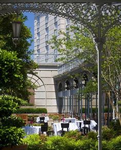 an outdoor dining area with tables and chairs