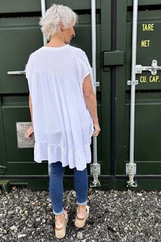 Elevate your everyday look with our Dawn V-Neck Frill Top in white. This gorgeous top is not only stylish, but also super easy to style for any occasion. With its flattering v-neckline and effortless fit, you'll love throwing it on for a quick and fashionable outfit. -V neckline -Short sleeves -Frill tier detailing Chic White V-neck Top For Day Out, White Relaxed Fit V-neck Top, White V-neck Top For Summer Vacation, Casual White Relaxed Fit V-neck Top, White Cotton V-neck Top For Summer, White V-neck Top For Spring Vacation, White V-neck Summer Top, White Relaxed Fit V-neck Top For Spring, White Casual V-neck Blouse