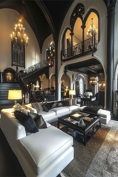 a living room filled with lots of furniture and chandelier hanging from the ceiling