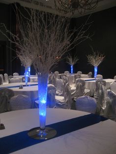 an image of a room set up for a wedding reception with blue and white decor