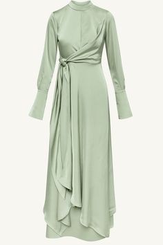 Effortlessly elegant, the Serena Satin Maxi Dress in Pistachio will make you stand out in any occasion. With a flattering mock neck, button flare sleeves, and an adjustable side tie, this dress is designed to make you feel confident and sophisticated. Perfect for any formal event or special occasion. Model is 5'7" and is wearing size XS/58". Beach Guest Wedding Dress, White Hijab Outfit, Hijabi Dresses, White Hijab, Laundry List, Fancy Fits, White Dress Formal, Nikkah Dress, Soiree Dress