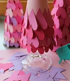 pink and purple paper trees are on the table