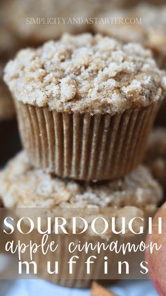 two muffins stacked on top of each other with the words sourdough apple cinnamon muffins