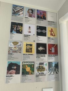 the wall is covered with many different posters