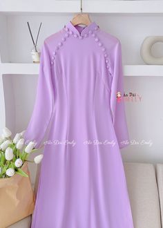 🌸 Material: Double layers chiffon. Pants included Stretchy level: 3/10 🌸 The measurement of this ao dai is in Vietnamese size. American size tends to be bigger for the same size. Please look at the SIZE CHART CAREFULLY before ORDERING. There might have some chalk writings on the fabric, these marks can be washed away. 🌸 No returns or exchanges. Buyer can contact seller about any issues with an order. 🌸 Follow us Facebook/aodaiemily www.aodaiemily.com 💜 Thank you very much💜 Elegant Purple Dress With Buttons, Elegant Fitted Purple Ao Dai, Purple Long Sleeve Ao Dai For Spring, Pastel Purple Color, Elegant Blue Floor-length Ao Dai, Luxury Floor-length Ao Dai For Women, Luxury Full-length Ao Dai For Women, Elegant Floor-length Fitted Ao Dai, Chiffon Pants