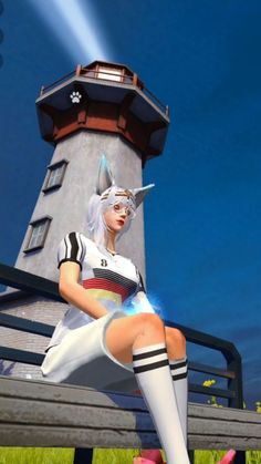 a woman sitting on top of a bench next to a light house