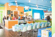 the inside of a restaurant with tables and chairs