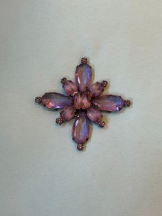 Stunning pave rhinestone (glass) purple flower brooch from Giorgio Armani, circa 1990s.   Runway piece.  Would look stunning on a sweater, scarf, or coat. Estate item.  Mint condition.  Held in my hand for size reference.  Please contact for additional item information and / or photos. Thank you for looking Vintage Purple Brooch For Party, Vintage Purple Brooches For Party, Elegant Purple Rhinestone Brooches, Purple Rhinestone Party Brooches, 1990s Runway, Heidi Daus, Sweater Scarf, Disc Necklace, Beautiful Sweater