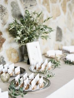 a table topped with plates and place cards