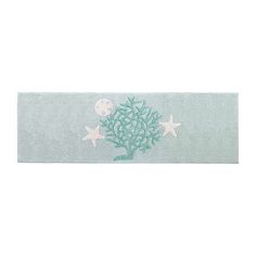 a bath mat with stars and seaweed on it