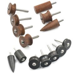 several different types of woodworking tools on a white surface with screws and nails