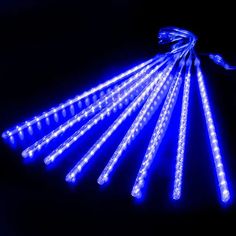 blue led lights are arranged on a black background